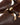 Luis Onofre Taper brown embossed patent leather kitten heels with gold crescent bow
